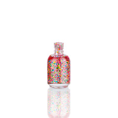 Colorful nail polish in glass bottle white background isolated close up, opened multicolored sequin varnish, bright shiny confetti lacquer, funny vivid enamel, beautiful festive decorative glitter gel
