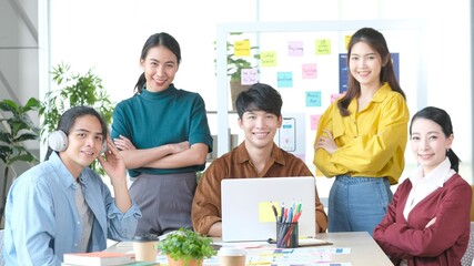 Group of asia creative teamwork smiling and looking at camera while meeting at home office, Corporate people