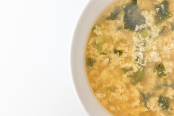 Egg soup on white background