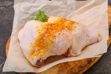 Raw chicken thigh with spices