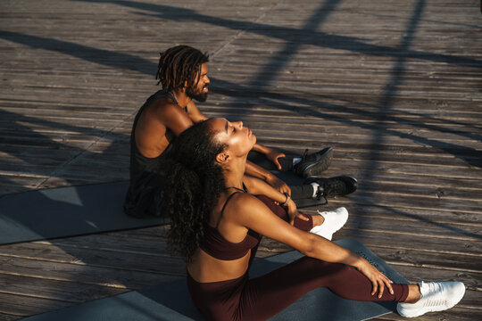 Attractive Young African Couple Exercising