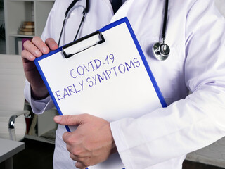 Health care concept about COVID-19 EARLY SYMPTOMS with phrase on the sheet.