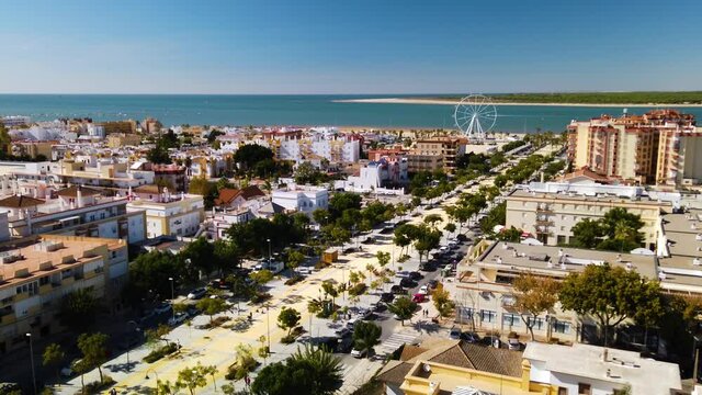 Aerial view of Sanlucar cityscape and ocean on sunny day, Cadiz, Spain