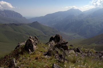 Alpine landscape with mountain peaks and green valleys. Caucasus, Russia. 