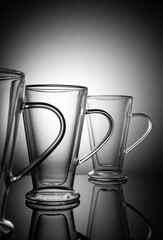 Glass glasses on gradient background with vignette