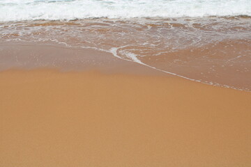 waves on the sand in a desert  beach