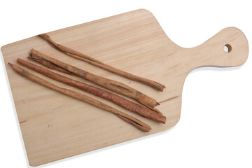 Cinnamon sticks on cutting board
