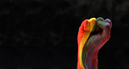 fist with rainbow. concept for lgbq protest agains discrimination