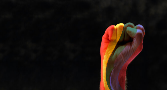 fist with rainbow. concept for lgbq protest agains discrimination