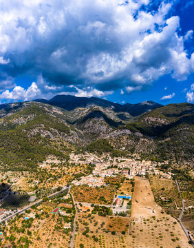 Aerial view, the village of Caimari municipality of Selva on the edge of the Tramuntana mountains with agriculture, center of the island, Mallorca, Balearic Islands, Spain
