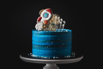 Space-themed cake on the black background