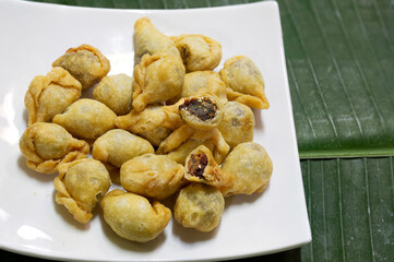 Fried flour molding thai ancient dessert which has fish filling stuffed, (Thai called 