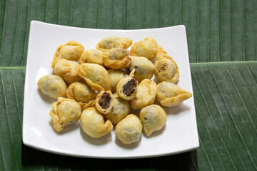 Fried flour molding thai ancient dessert which has fish filling stuffed, (Thai called 