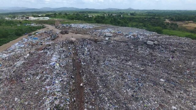 Overfly poor people collecting garbage at Duquesa landfill, Santo Domingo