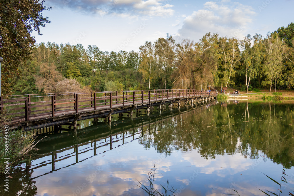 Wall mural an old wooden bridge at lake gebart (gebarti-to) in zalaegerszeg, hungary