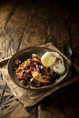 Homemade apple berry crumble with vanilla ice cream
