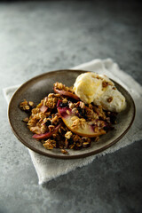 Homemade apple berry crumble with vanilla ice cream