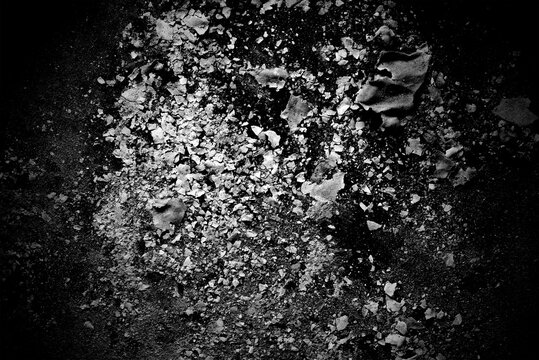 Black and white image of burned paper ash. Abstract black and white background. Paper ash texture.