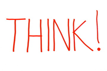 Handwritten inscription Think in red marker on a white background