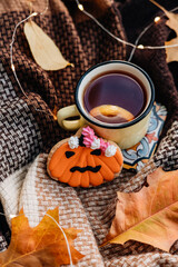 halloween decoration, homemade cookies, Halloween food background -Gingerbread Cookies with yellow cup of tea