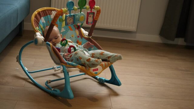 joyful baby little baby swinging in the rocker baby bouncer rocking chair