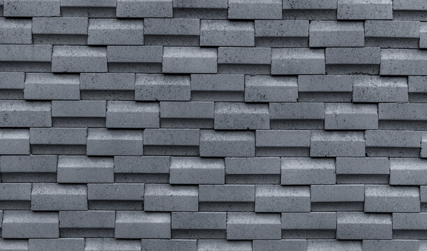 Fototapeta Gray brick wall with simple pattern. Gray wall texture abstract background. Modern design of brick wall background. Simple abstract wallpaper. Concrete surface texture. Exterior architecture design.