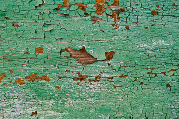 Old green board with cracks. Selective focus.