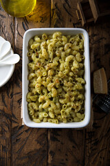 Homemade pasta bake with pesto sauce