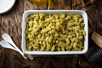 Homemade pasta bake with pesto sauce