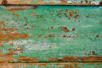 Old green board with cracks.