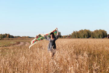 Beautiful girl with black hair. a girl in a wheat field, a girl with a bandana,
