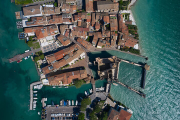 Sirmione, Lake Garda, Italy. Unique aerial view of Sirmione Castle. Summer time of the year. Blue water of the lake.
