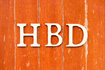 Alphabet letter in word HBD (Abbreviation of happy birthday) on old red color wood plate background