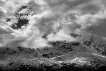 panoramic view of picturesque snowy mountains tops on blue sky background