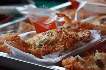 Thai food, Crispy fried clams mixed with bean sprouts.