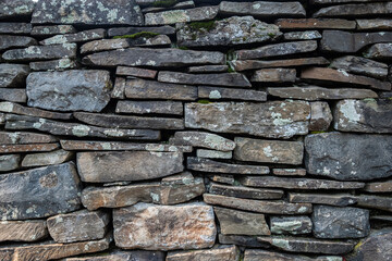 Rustic stone wall border with moss accents
