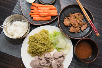 Asian oriental food composition, served on dark rustic background, top view. Thai cuisine set, japanese, chinese, korean.