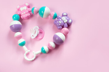 Children's toy rattle, pink and blue beads