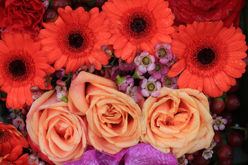 Orange and pink flower arrangement for a wedding