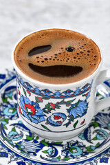 Traditional Turkish coffee over wooden table close-up     