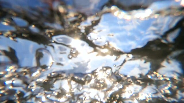 Abstract view of water surface of strong current stream of river downstream