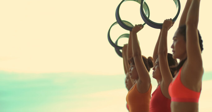 Professional group females yoga practice in class on mat stretching - Powered by Adobe