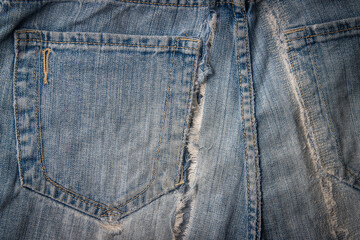 Detail,Texture of the old torn blue jeans.