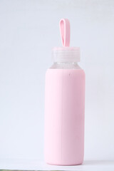 Close up of pink water bottle on table 
