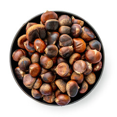 Roasted chestnuts on a round plate  isolated on white background. Top view. Healthy nuts close-up.