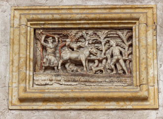Stone bas-relief on the wall at the exposition in the courtyard of the Museo Lapidario Maffeiano in Verona, Italy