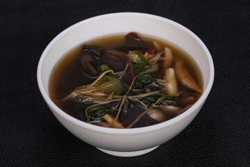 Thai style soup with meat and mushrooms