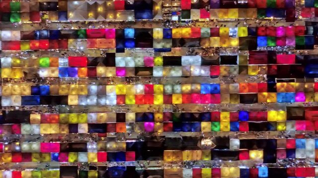 Flyby of colorful bejeweled like Ratchada night market in Bangkok.
