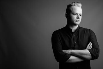 Portrait of businessman with Mohawk hairstyle and blond hair