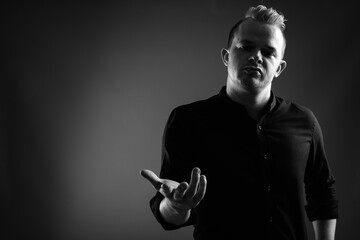 Portrait of businessman with Mohawk hairstyle and blond hair